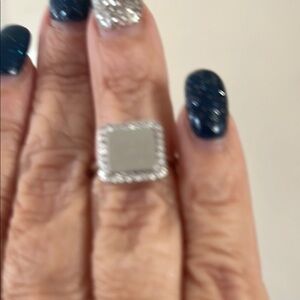 Silver Square Ring with czs around it. Adjustable. Size 5. Probably engraveable